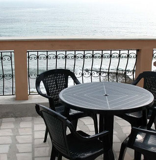 Sea-view terrace with wrought iron railing